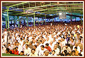  Devotees keenly listen to the discourse