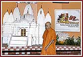 Swamishri walks past the Shila and the Mandir Model 	