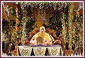 Swamishri performs his morning pooja in a garden setting 