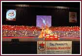 morning ,Swamishri performs pooja in front of a massive annakut offering to Shri Harikrishna Maharaj 
