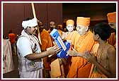 Evening,A Bal Karyakar dressed as a shepherd presents Swamishri with a 'Key to the City'