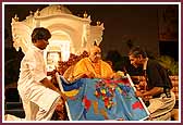 Morning,	Swamishri is presented with a map depicting his vicharan 	