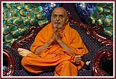 Swamishri humbly folds his hands in prayer prior to blessing the assembly