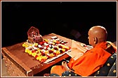  Swamishri turning the rosary in pooja