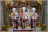 Colourful garments offered to the sacred images of Dham, Dhami and Mukta 