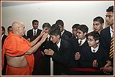  Swamishri blessing students from The Swaminarayan School