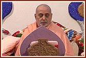 Swamishri meditating and saying the rosary during his morning puja 