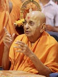 Swamishri in a divine mood blessing the devotees