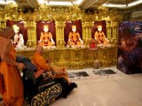 Swamishri engaged in darshan of Shri Guru Parampara