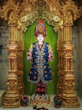 Shri Ghanshyam Maharaj adorned with flowers
