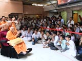 Devotees engaged in darshan of Swamishri