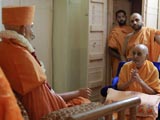  Swamishri engaged in darshan of Brahmaswarup Shastriji Maharaj