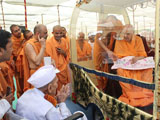  Swamishri blesses an old devotee