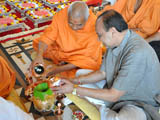  Sadhus and devotees engaged in patotsav mahapuja rituals