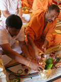  Sadhus and devotees engaged in patotsav mahapuja rituals