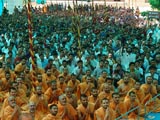  Sadhus and devotees engaged in Swamishri's darshan