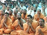  Sadhus and devotees engaged in Swamishri's darshan