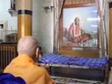  Swamishri engaged in darshan of Brahmaswarup Shastriji Maharaj