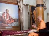  Swamishri engaged in darshan of Brahmaswarup Shastriji Maharaj