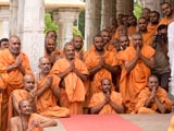 Sadhus engrossed in Swamishri's Darshan