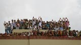  Devotees joyfully doing darshan of Swamishri