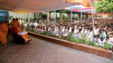  Swamishri bids Jai Swaminarayan while devotees sing kirtans accompanied by traditional musical instruments