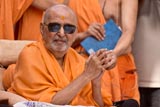 Swamishri observing the skit presentation