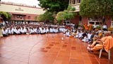 Devotees attending a discourse by sadhus while waiting for Swamishri's arrival