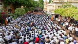 Devotees attend a sabha while waiting for Swamishri's darshan