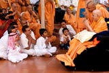 Swamishri blesses kids