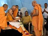  Swamishri is honored with a garland