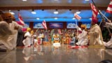  Swamishri and youths wave BAPS flags