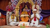  Swamishri initiates a youth, giving him parshadi diksha