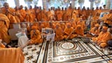 Sadhus in front of Swamishri in the mandir