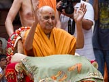 Swamishri blesses the devotees changing their sacred threads