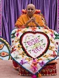  Sadhus honor Swamishri with a shawl