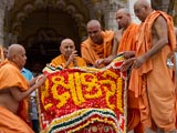  Sadhus honor Swamishri with a shawl