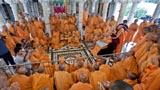  Swamishri with sadhus beneath the mandir dome