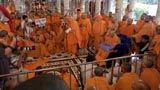  Swamishri with sadhus beneath the mandir dome