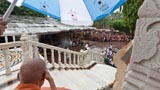  Devotees doing darshan of Swamishri amidst rain