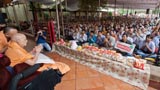  Devotees and volunteers doing darshan of Swamishri