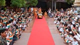  Devotees welcome Swamishri while waving the Indian tricolor  