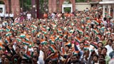  Devotees welcome Swamishri while waving the Indian tricolor  