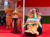  Swamishri salutes during the national anthem