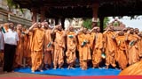  Sadhus salute during the national anthem