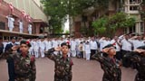  Devotees salute during the national anthem