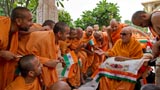  Swamishri converses with sadhus in the mandir pradakshina