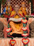  Sadhus honor Swamishri with a garland