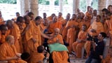  Swamishri with sadhus beneath the mandir dome