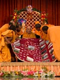  Sadhus honor Swamishri with a shawl